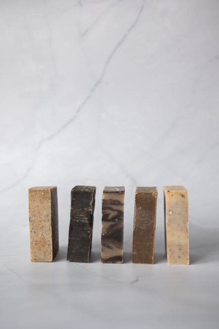 Handmade soap bars curing on a drying rack
