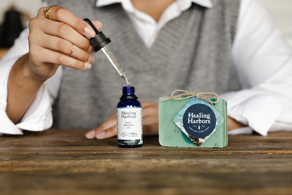 Measuring essential oil, which scents a beard balm at just 1 to 2 percent