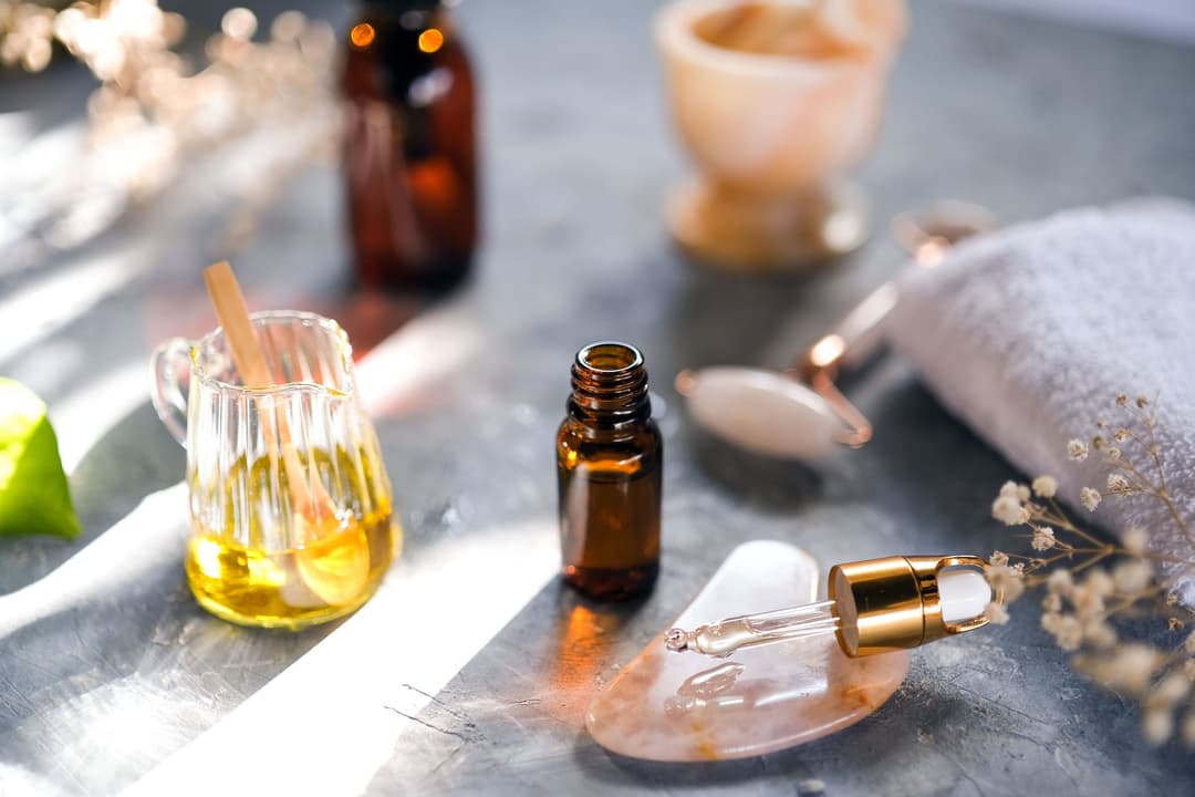 Measuring fragrance oil on a scale for a wax melt batch