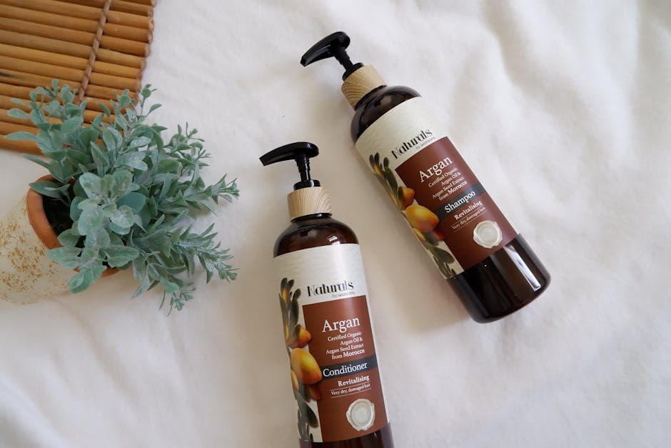 Natural shampoo and conditioner bottles with essential oil ingredients