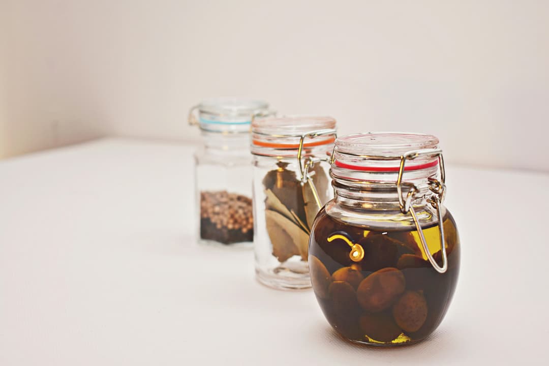Variety of soap making oils including olive oil, coconut oil, and shea butter