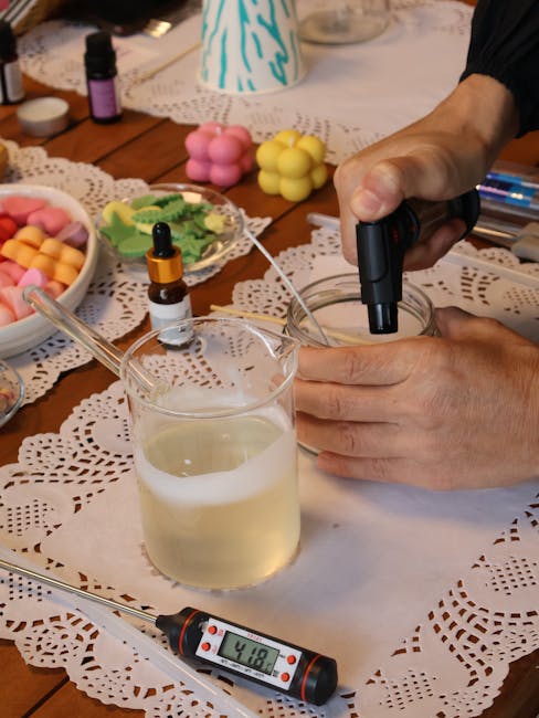 Hands crafting cold process soap in a DIY soap making setup