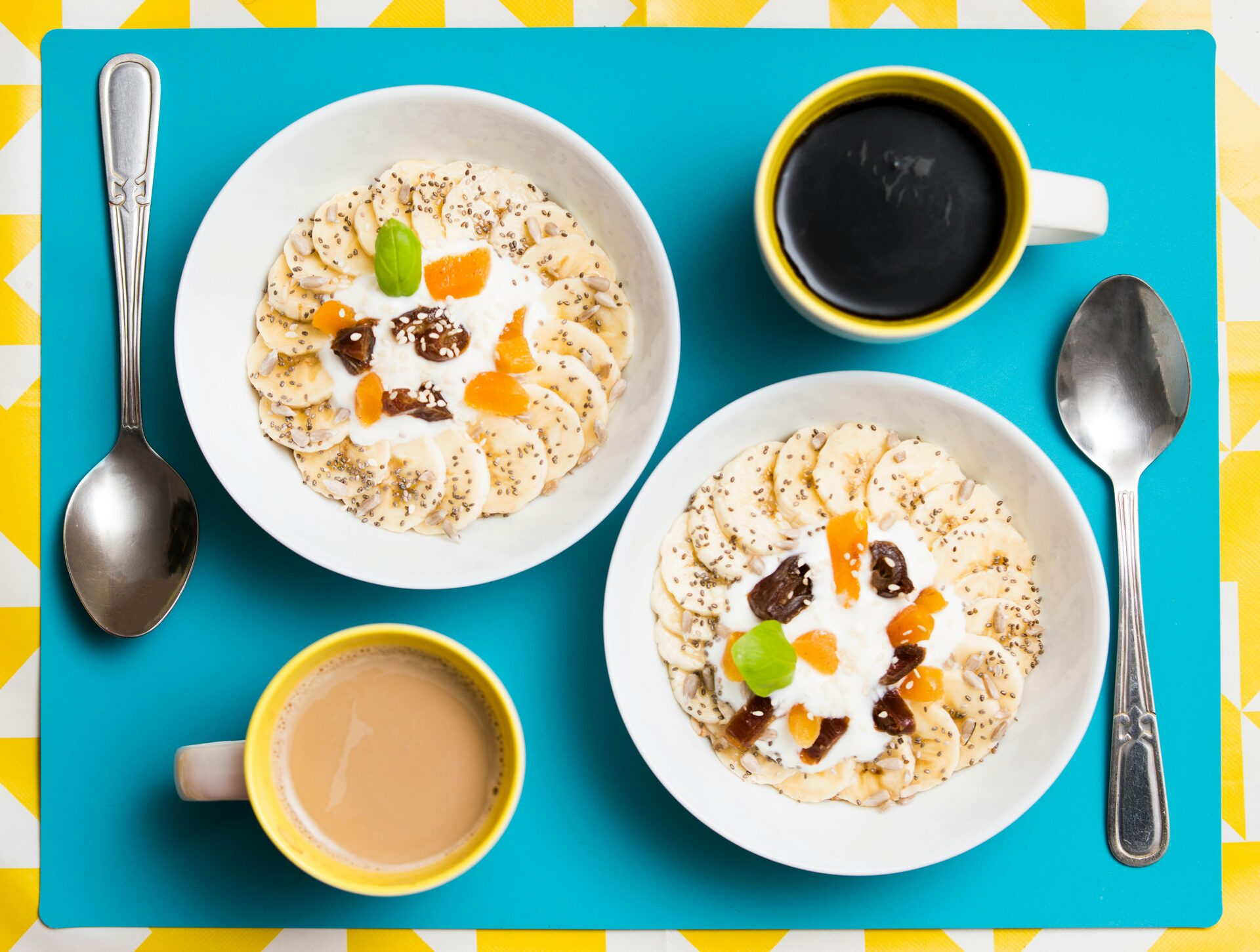 Natural soap exfoliants like coffee grounds and oats in bowls