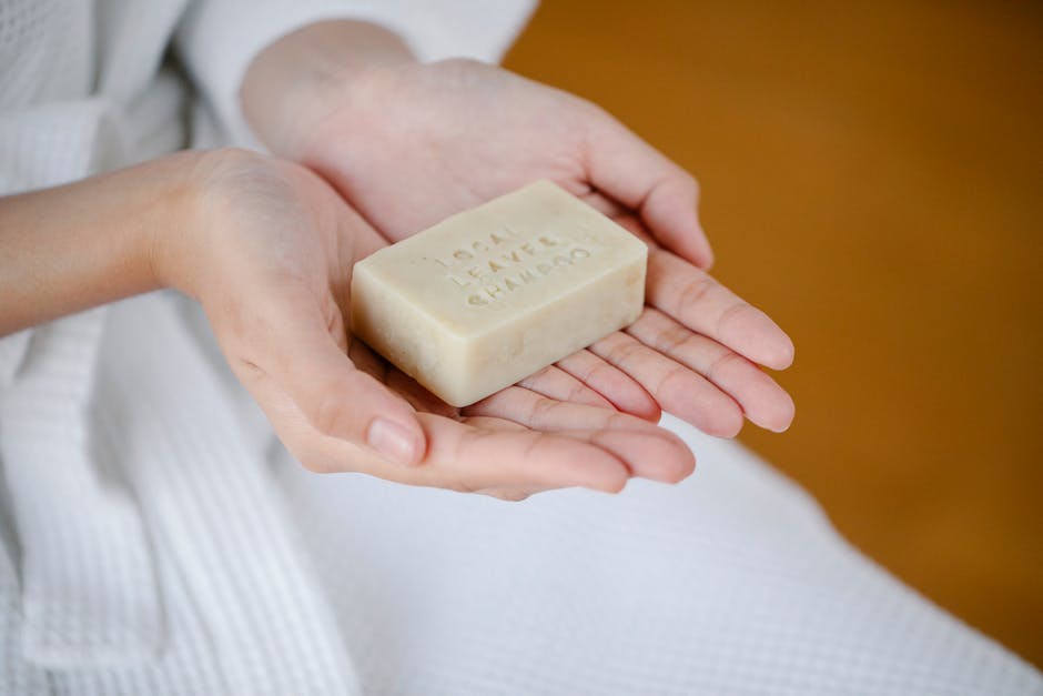 Woman holding natural shampoo bar in bathroom setting