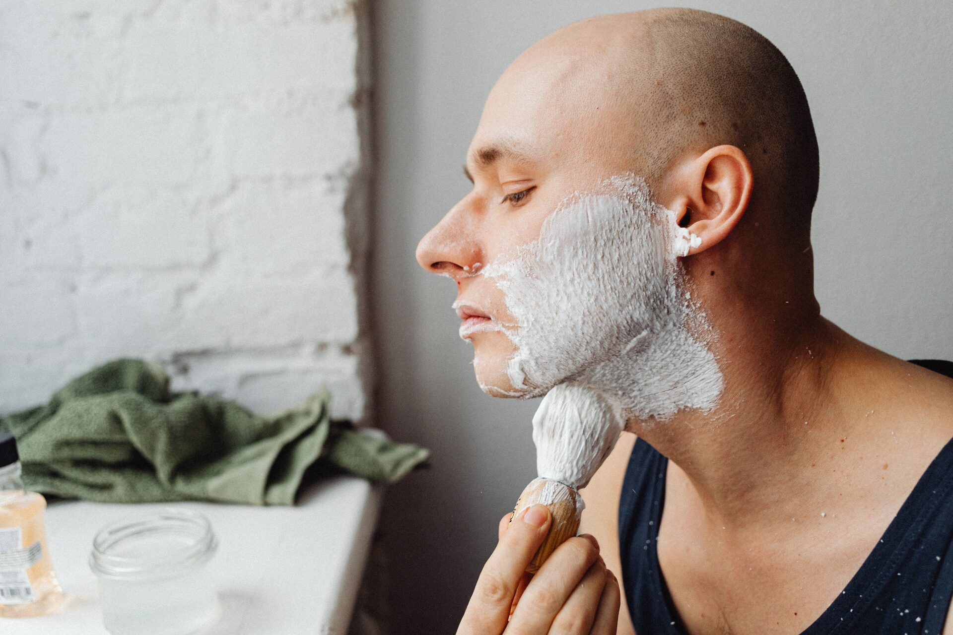 A shaving brush building a rich lather