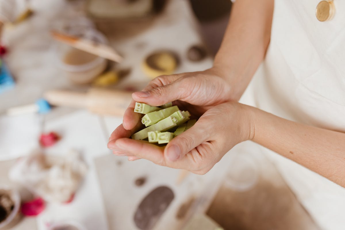 Soap maker crafting handmade bars in a home workshop
