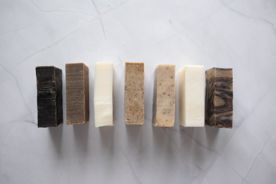Colorful bars of tea tree soap with different natural additives
